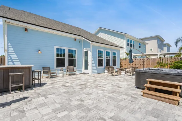 a view of a dinning table and chairs in the patio
