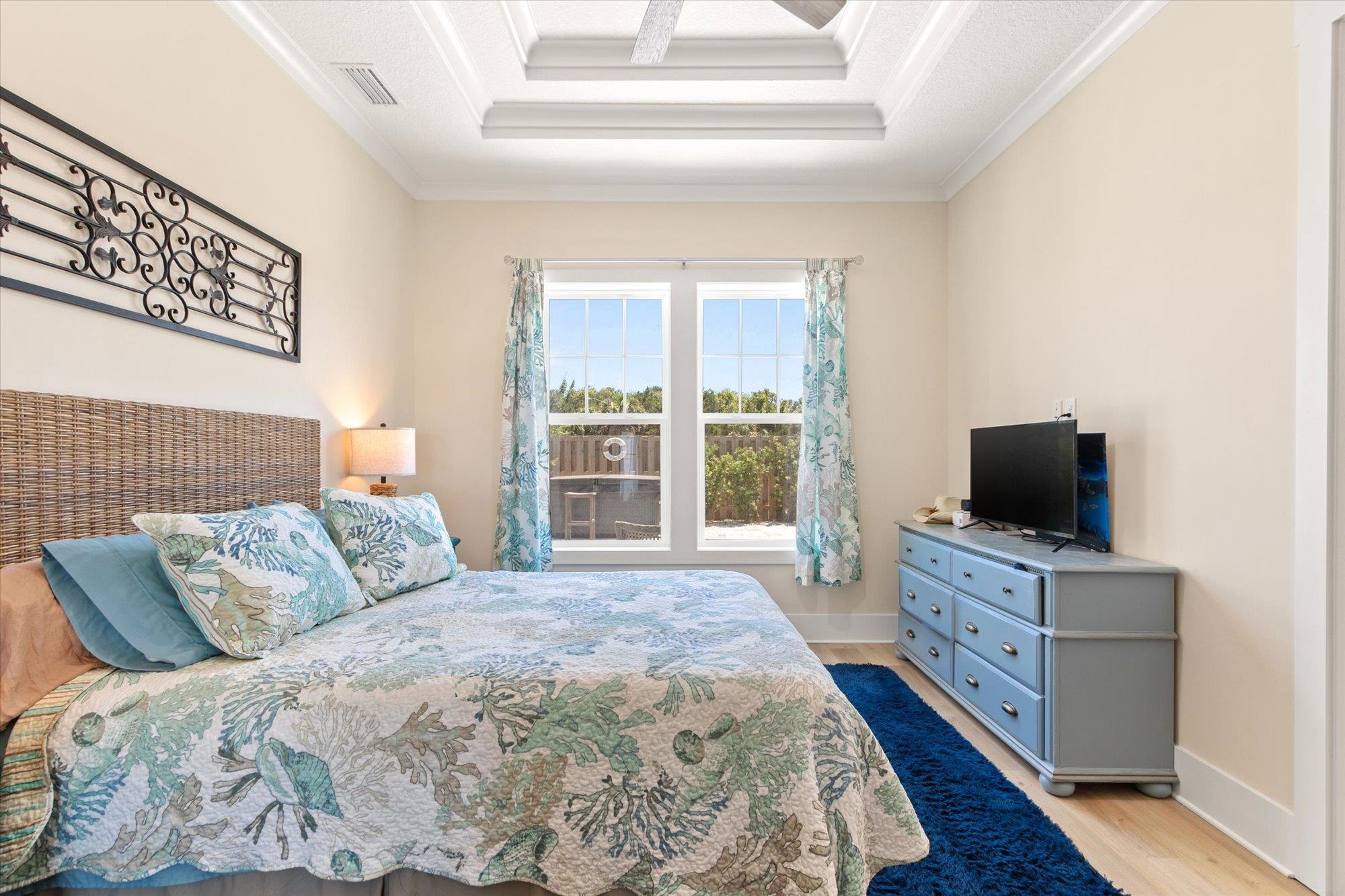 125 5th Street St. Augustine, FL 32080 - Photo 18 of 51 a bedroom with a bed and a television