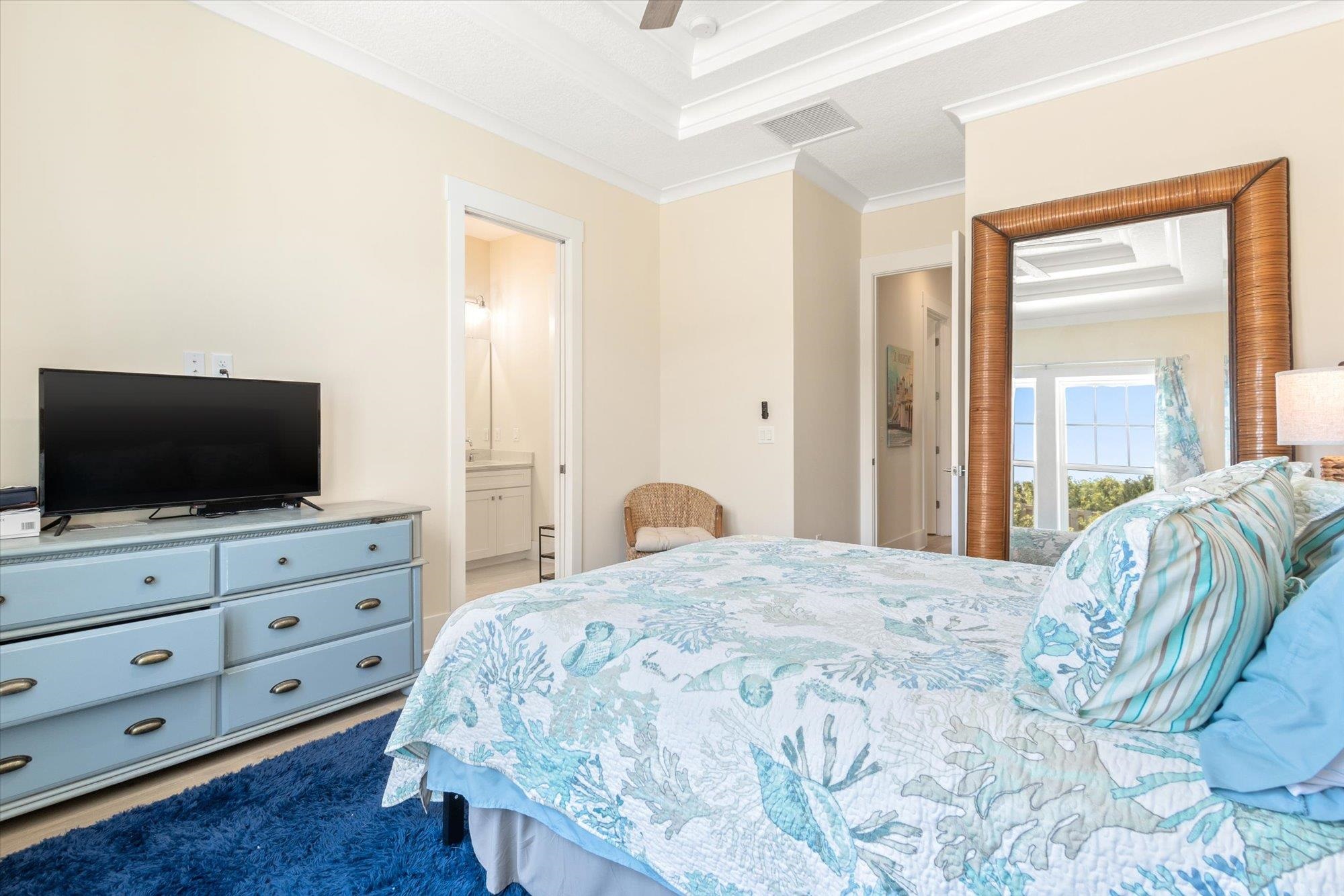 125 5th Street St. Augustine, FL 32080 - Photo 20 of 51 a bedroom with a large bed and flat tv screen on dresser