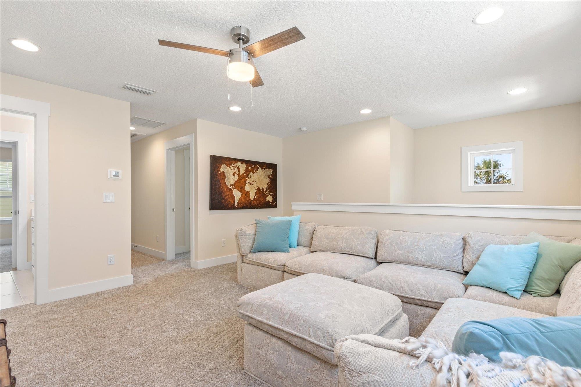 125 5th Street St. Augustine, FL 32080 - Photo 26 of 51 a living room with furniture and a ceiling fan