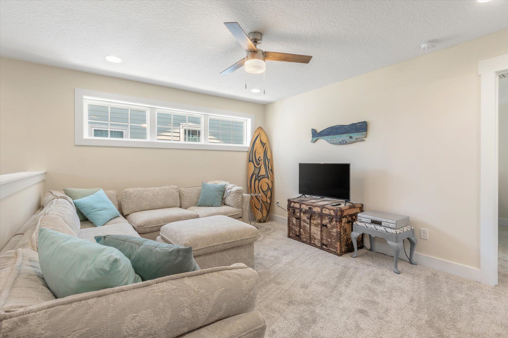125 5th Street St. Augustine, FL 32080 - Photo 28 of 51 a living room with furniture and a flat screen tv