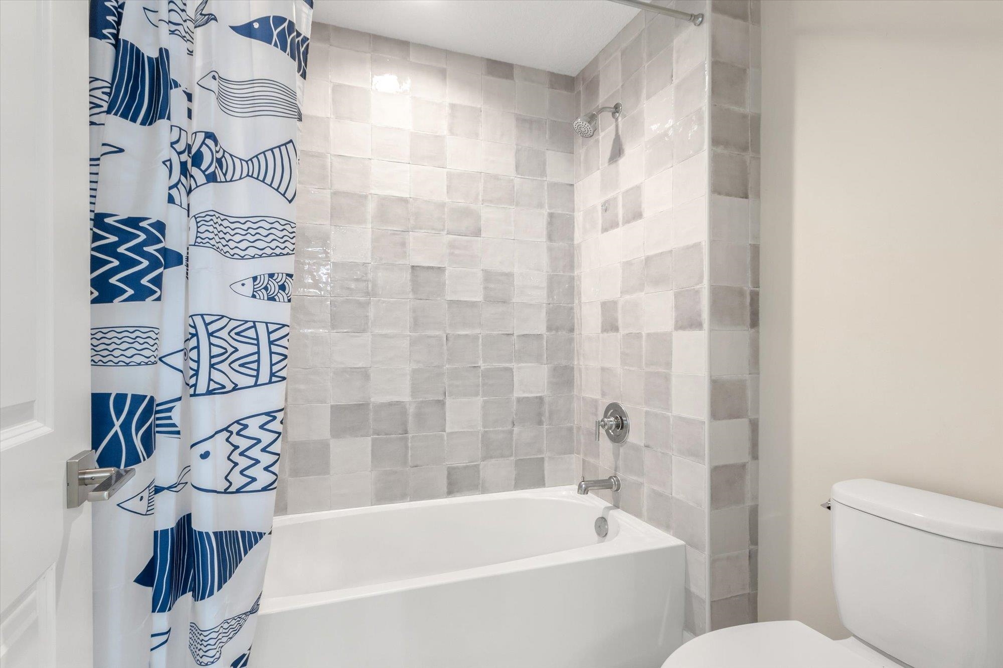 125 5th Street St. Augustine, FL 32080 - Photo 32 of 51 a bathroom with a bathtub and shower