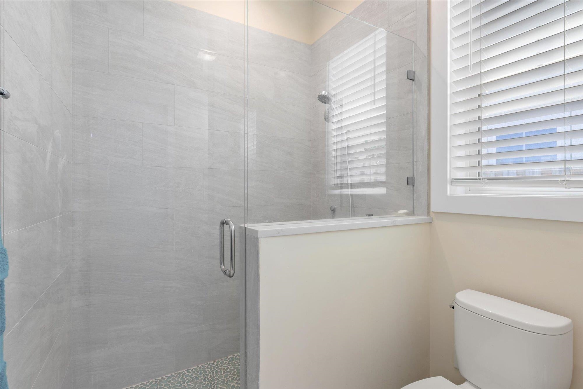 125 5th Street St. Augustine, FL 32080 - Photo 38 of 51 a bathroom with a shower and a toilet