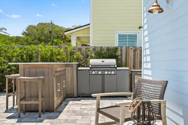 a view of a patio with a table and chairs