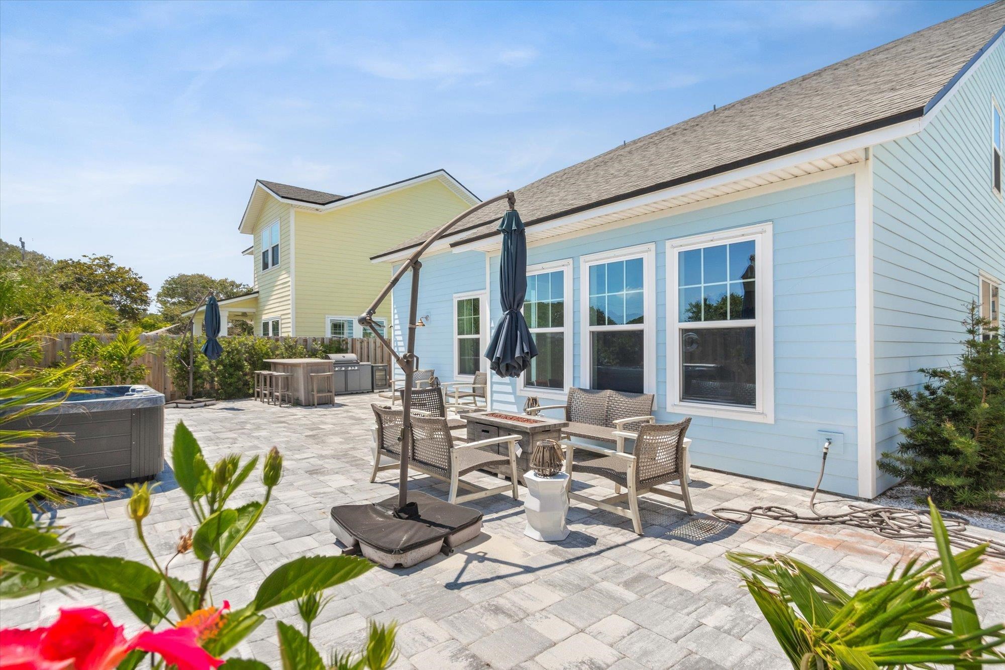 125 5th Street St. Augustine, FL 32080 - Photo 42 of 51 a view of a patio with couches table and chairs and potted plants
