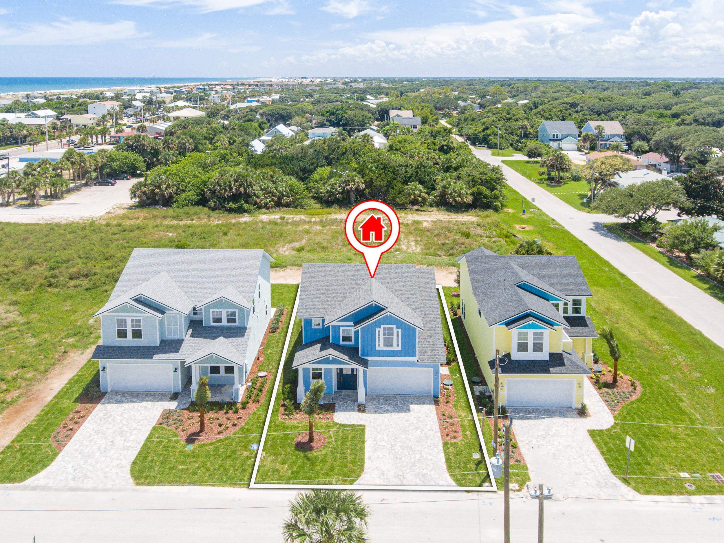125 5th Street St. Augustine, FL 32080 - Photo 44 of 51 an aerial view of a house with a big yard and large trees