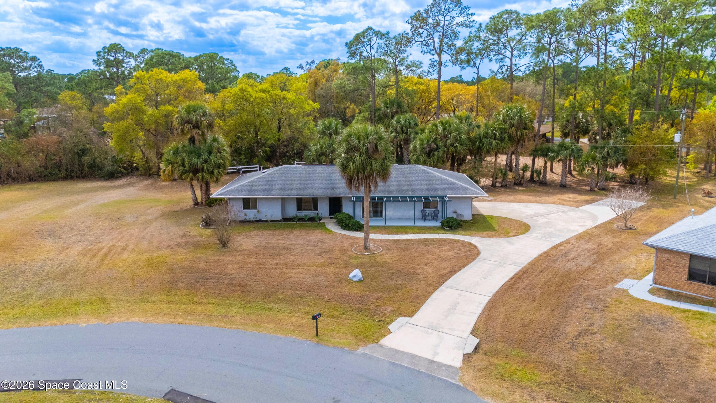 1782 Sand Road Southeast Palm Bay, FL 32909 - Photo 3 of 56 DJI_20260227021202_0257_D_GRACE5K