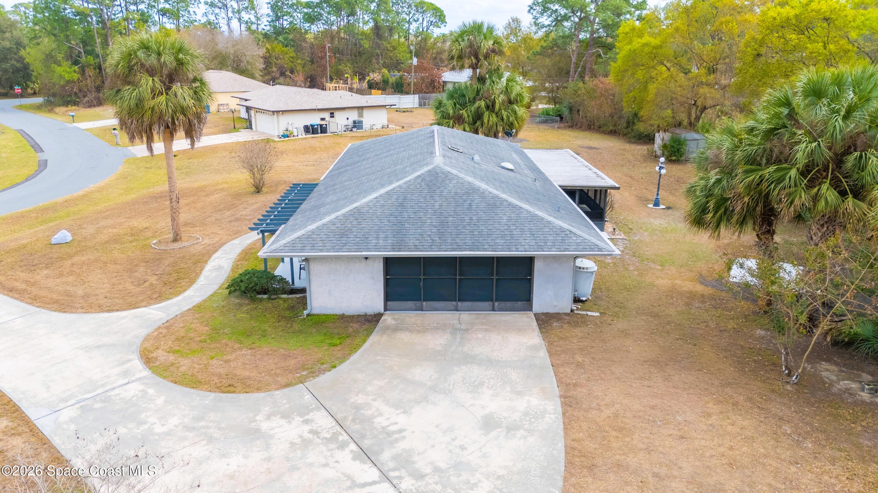 1782 Sand Road Southeast Palm Bay, FL 32909 - Photo 43 of 56 DJI_20260227021621_0266_D_GRACE5K