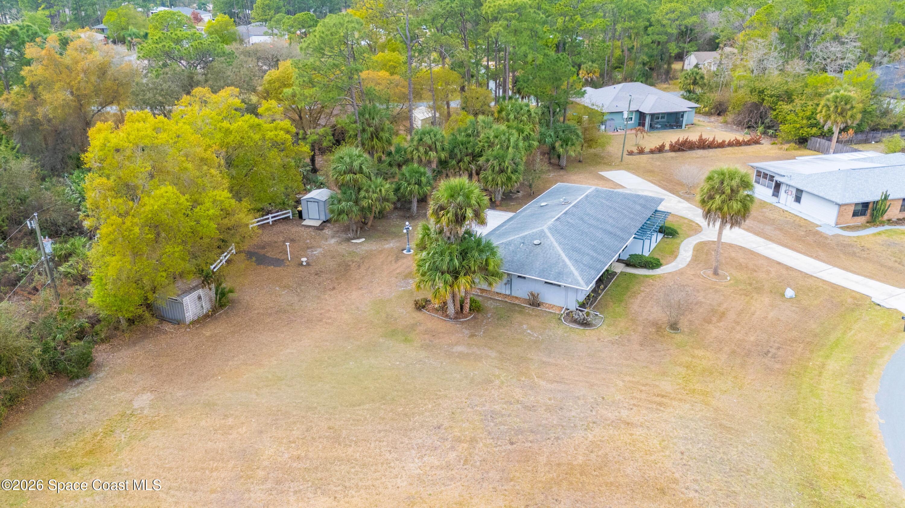 1782 Sand Road Southeast Palm Bay, FL 32909 - Photo 46 of 56 DJI_20260227022243_0276_D_GRACE5K