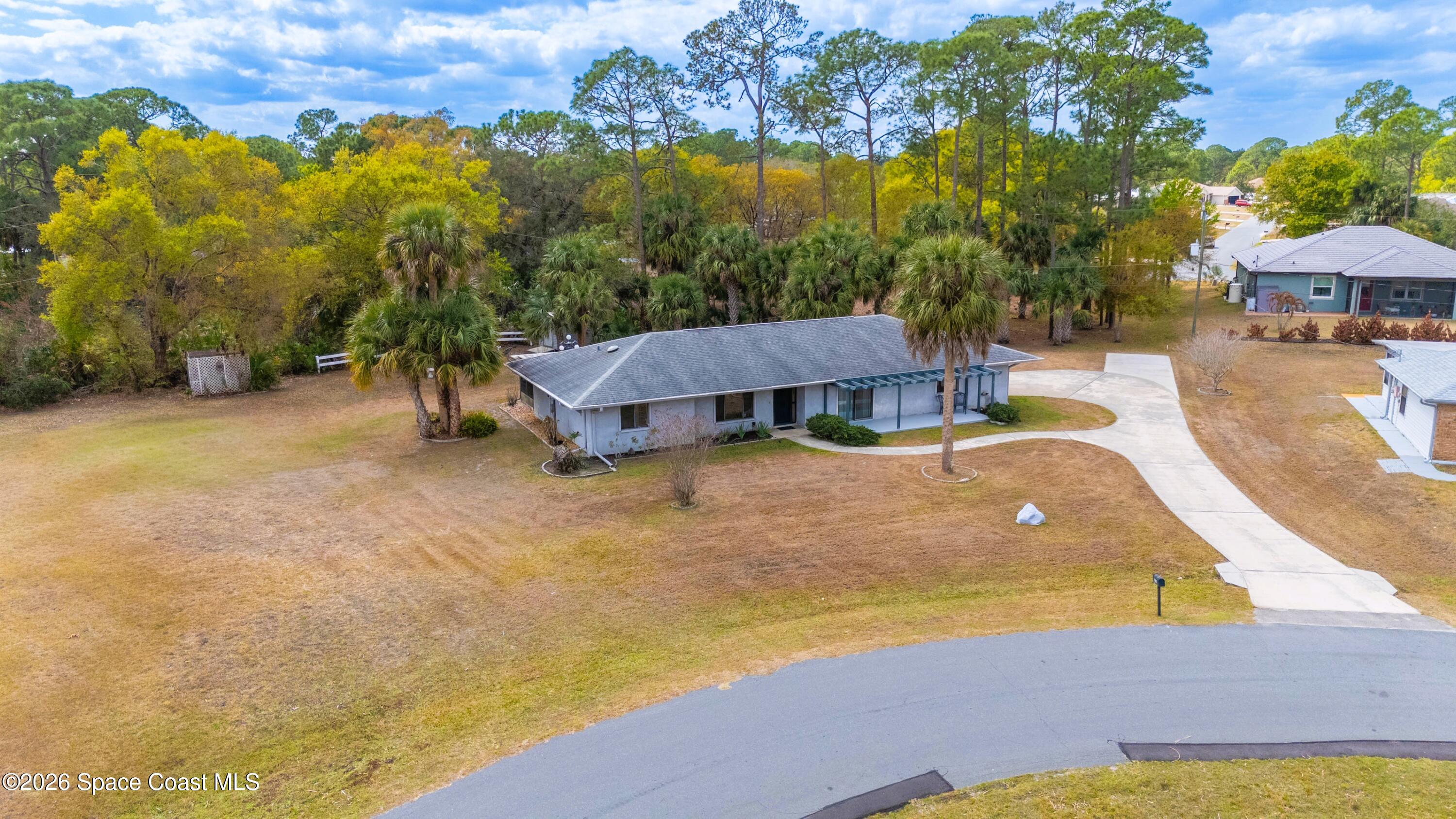 1782 Sand Road Southeast Palm Bay, FL 32909 - Photo 47 of 56 DJI_20260227021212_0258_D_GRACE5K