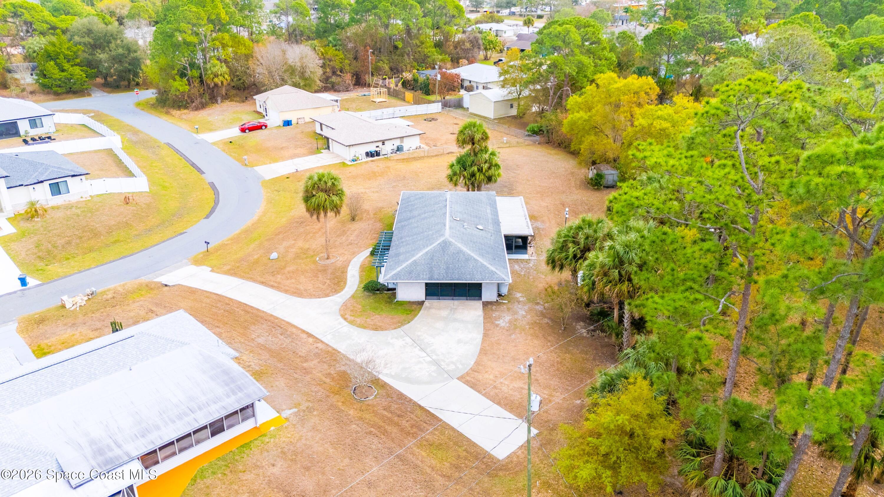 1782 Sand Road Southeast Palm Bay, FL 32909 - Photo 50 of 56 DJI_20260227021741_0269_D_GRACE5K