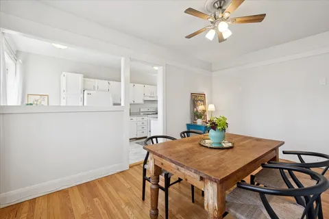 a view of a dining room with furniture and wooden floor