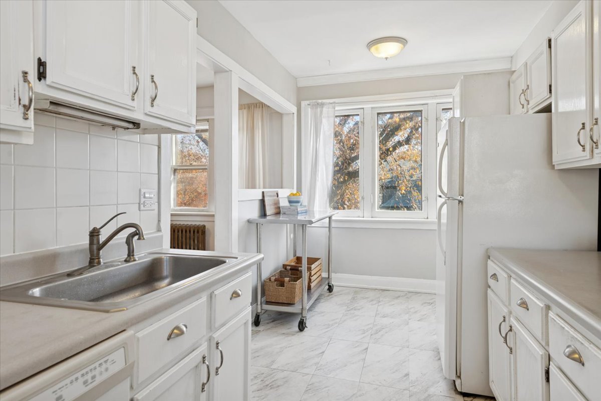 845 Pleasant Street, Unit 3E Oak Park, IL 60302 - Photo 16 of 22 a kitchen with a sink appliances and a window