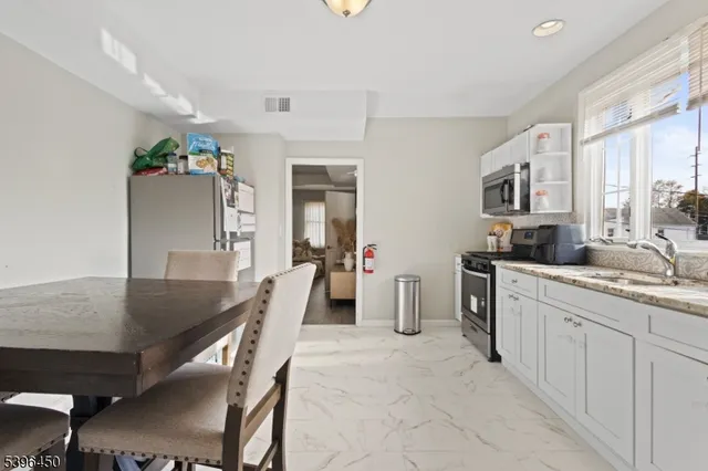 a kitchen with furniture and a sink