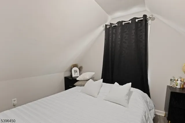 a bedroom with a bed and a walk in closet