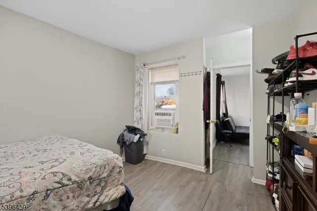 a bedroom with a bed and a closet