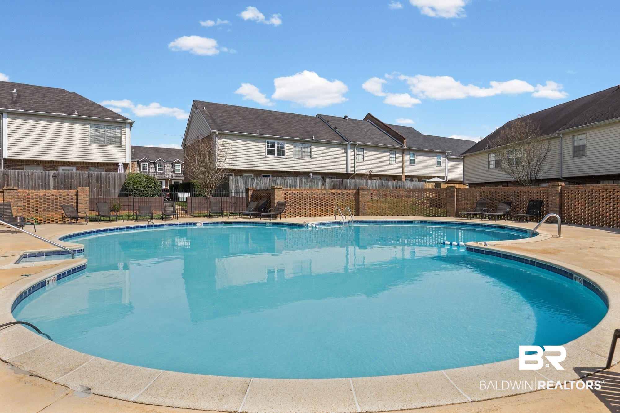 114 Du Rhu Drive, Unit A Mobile, AL 36608 - Photo 13 of 14 Community pool featuring a patio and a residential view