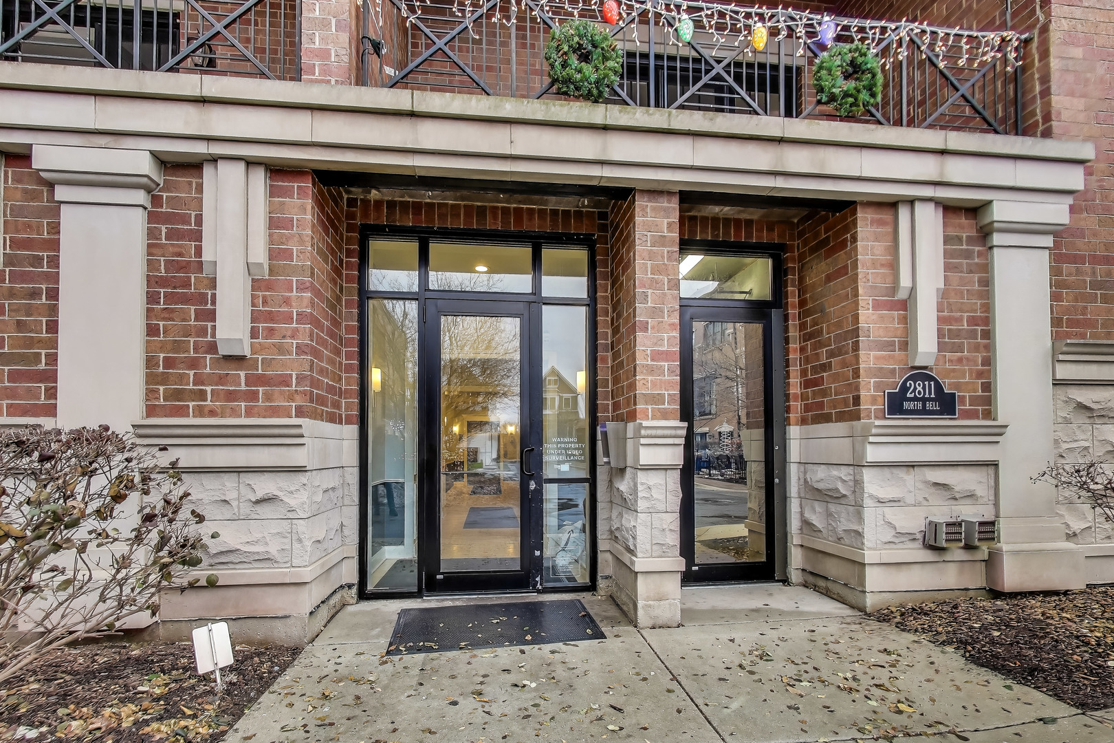 2811 North Bell Avenue, Unit 107 Chicago, IL 60618 - Photo 2 of 37 a view of entrance front of the house
