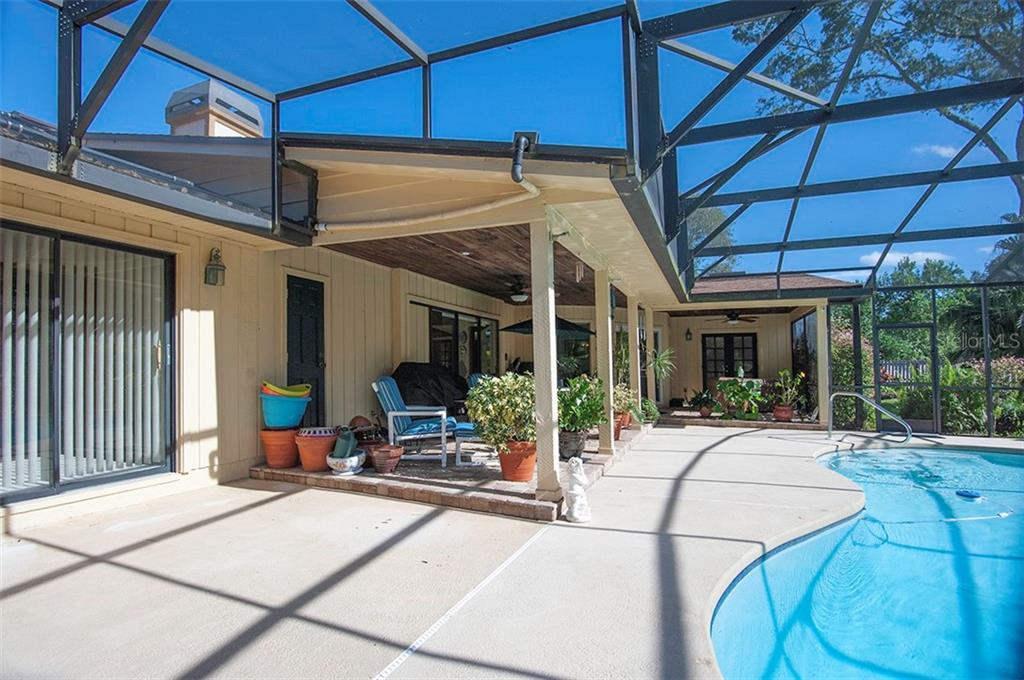 145 Spring Chase Circle Altamonte Springs, FL 32714 - Photo 37 of 54 The lanai is very large and spans nearly the whole house!
