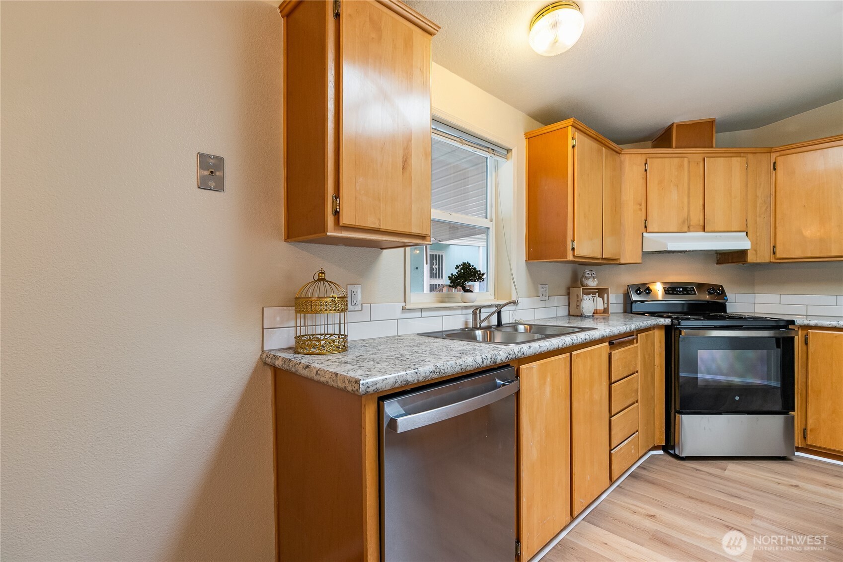 2350 Douglas Road, Unit 30B Ferndale, WA 98248 - Photo 11 of 36 a kitchen with stainless steel appliances granite countertop a sink a stove and cabinets