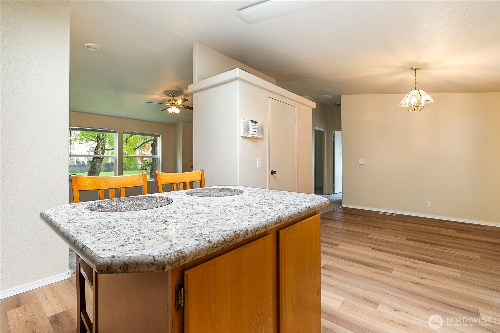 2350 Douglas Road, Unit 30B Ferndale, WA 98248 - Photo 14 of 36 a kitchen with granite countertop sink and wooden floor