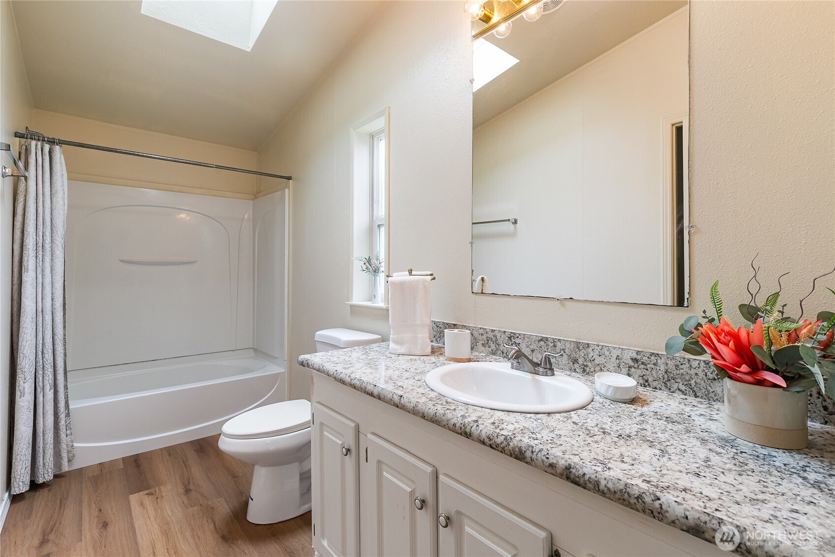 2350 Douglas Road, Unit 30B Ferndale, WA 98248 - Photo 24 of 36 a bathroom with a granite countertop sink mirror vanity and toilet