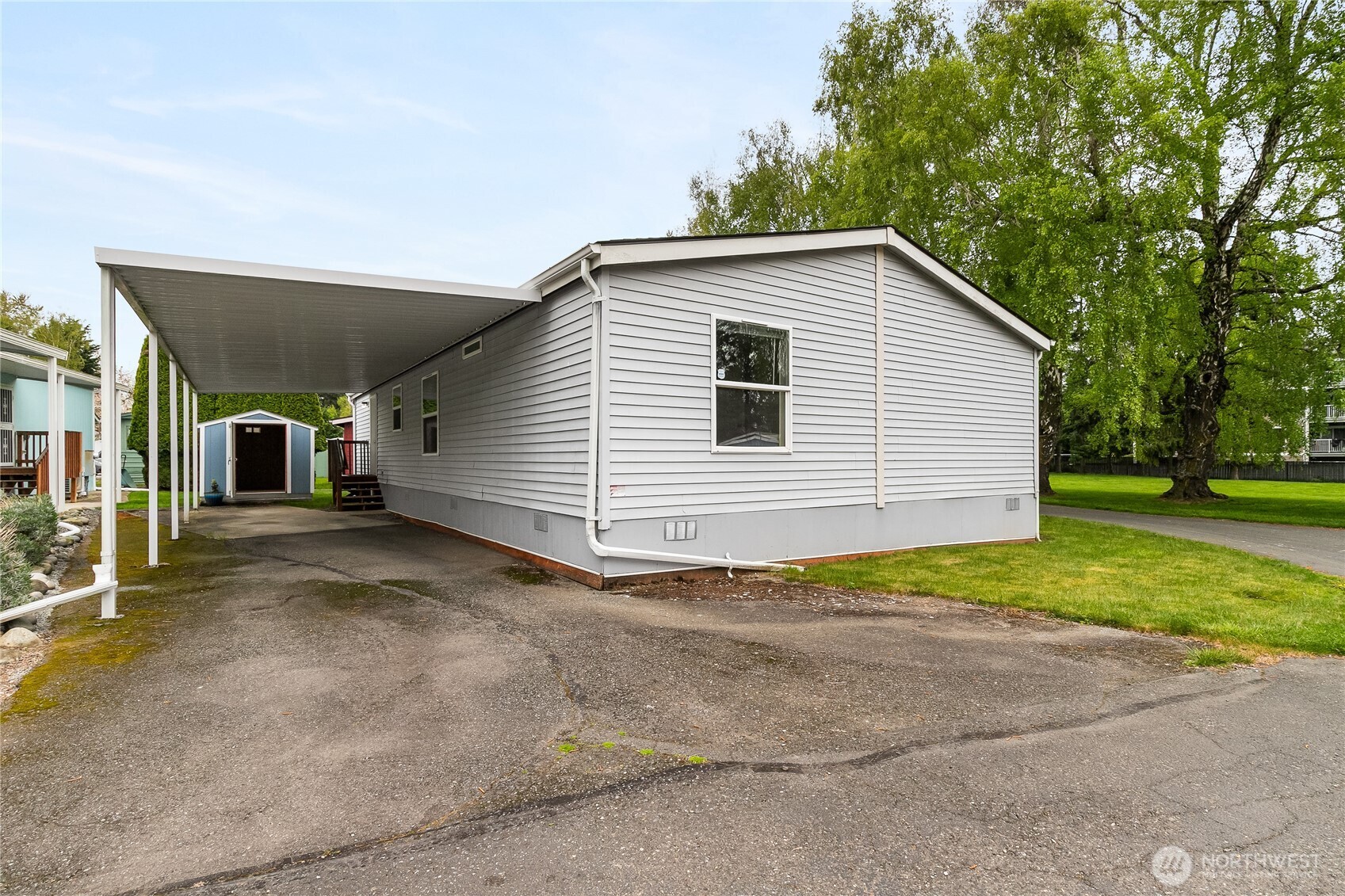 2350 Douglas Road, Unit 30B Ferndale, WA 98248 - Photo 35 of 36 a view of a house with a yard and garage