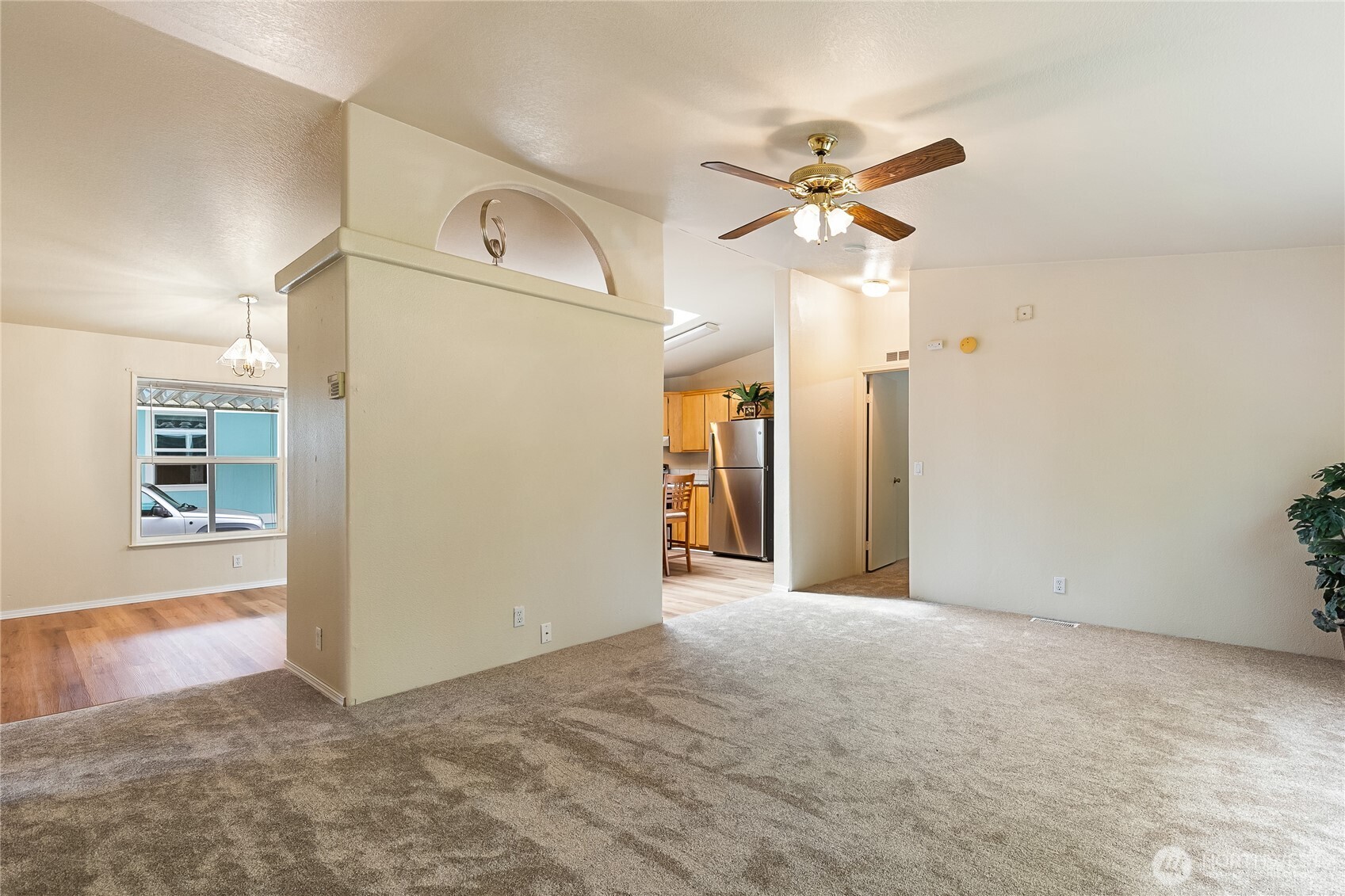 2350 Douglas Road, Unit 30B Ferndale, WA 98248 - Photo 5 of 36 a view of a hallway with a chandelier fan and windows