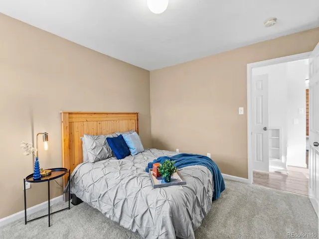 a bedroom with a bed and chair