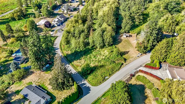 a bird view of multi story residential houses with yard and swimming pool