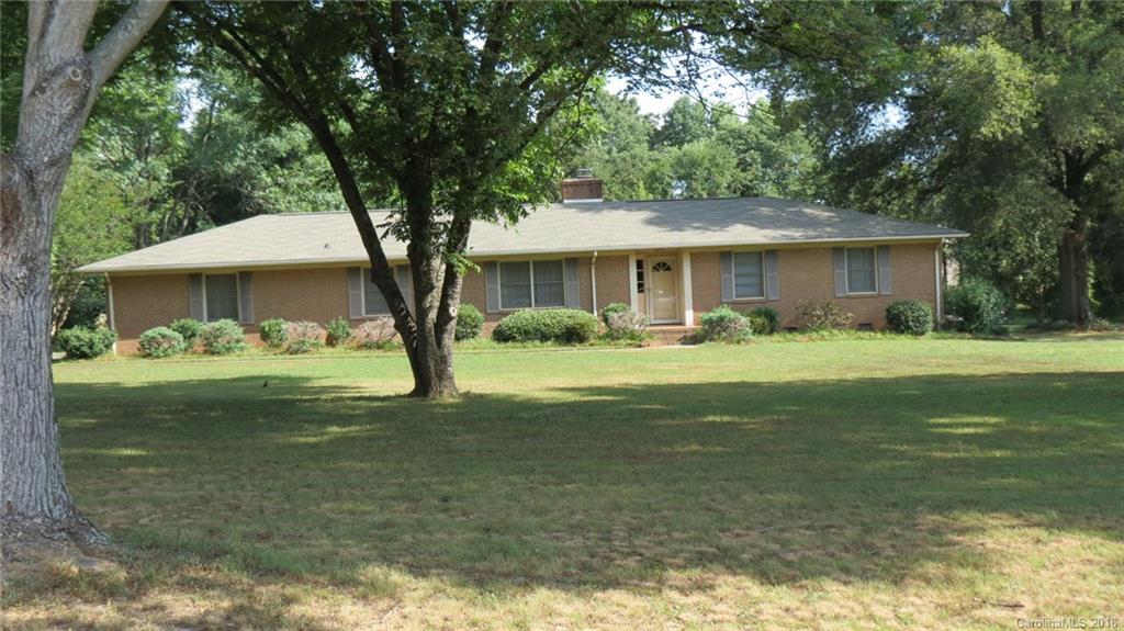 4706 Ridge Road Charlotte, NC 28269 - Photo 1 of 17 a front view of house with yard and green space