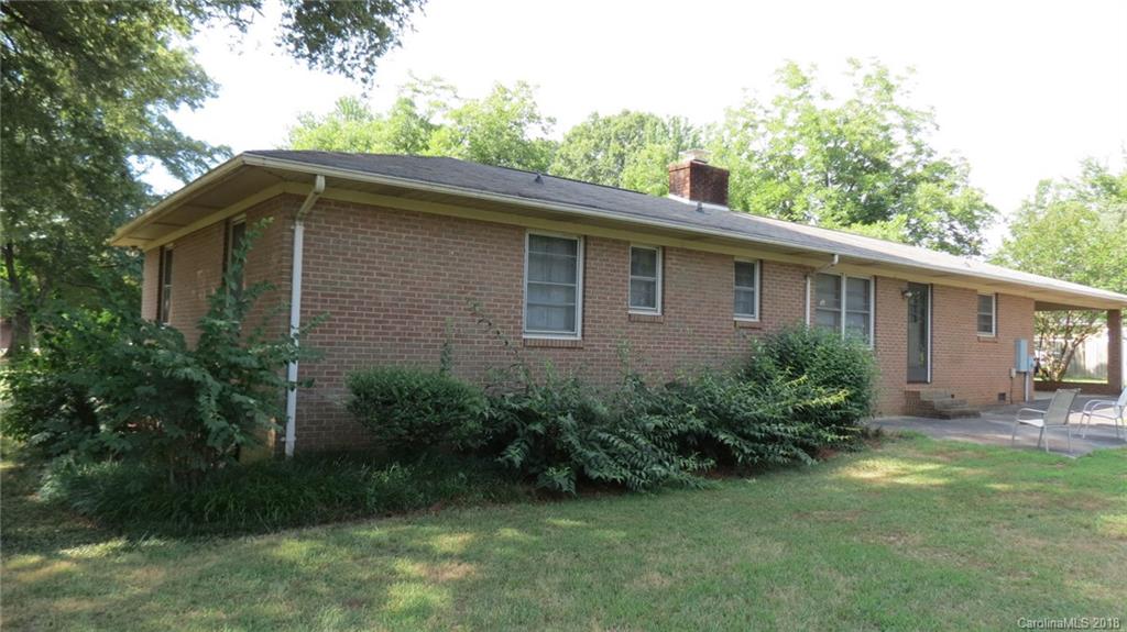 4706 Ridge Road Charlotte, NC 28269 - Photo 2 of 17 a front view of a house with garden
