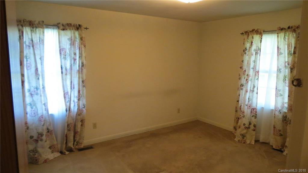 4706 Ridge Road Charlotte, NC 28269 - Photo 13 of 17 an empty room with windows