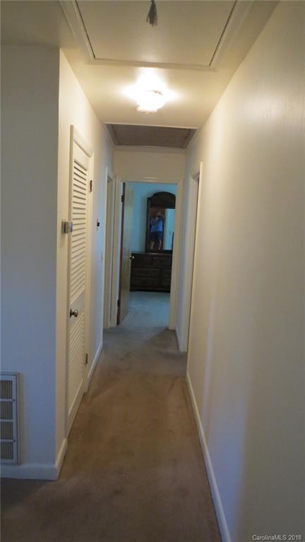 4706 Ridge Road Charlotte, NC 28269 - Photo 15 of 17 a view of a hallway with wooden floor and a in a room