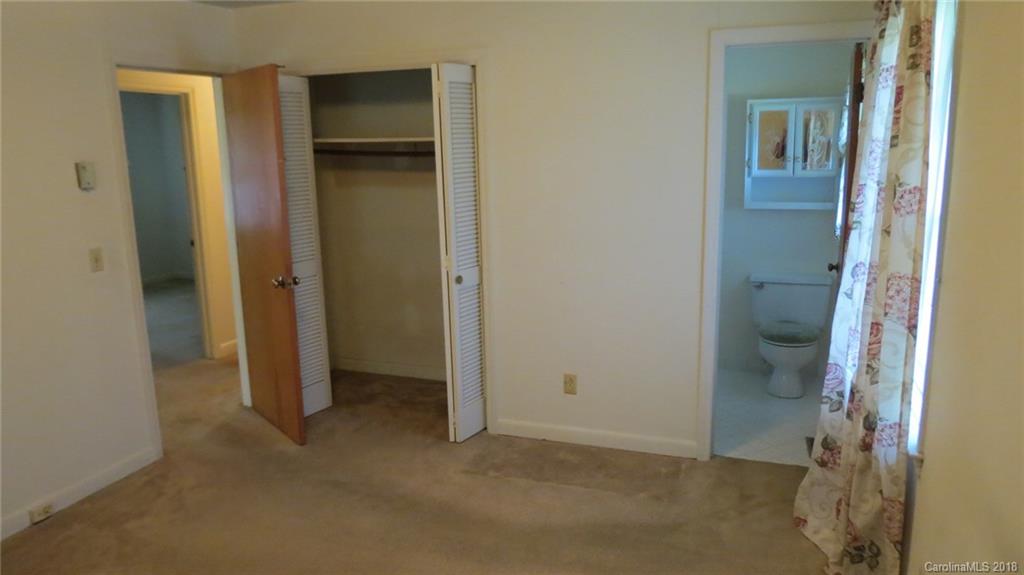 4706 Ridge Road Charlotte, NC 28269 - Photo 16 of 17 a view of an empty room with closet and wooden door