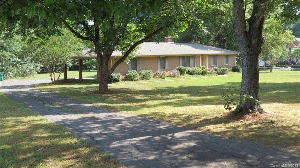 4706 Ridge Road Charlotte, NC 28269 - Photo 4 of 17 a front view of a house with a yard