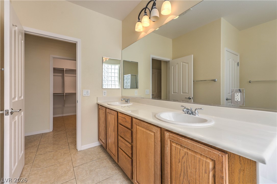 2276 Saxtons River Road Henderson, NV 89044 - Photo 21 of 49 Bathroom with Raised Vanity, Dual Sinks, Garden Tub, and Separate Shower