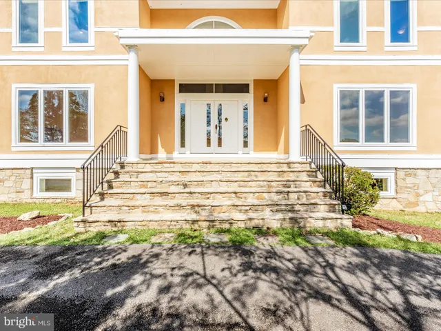 a spacious bathroom with a sink a mirror and a bathtub