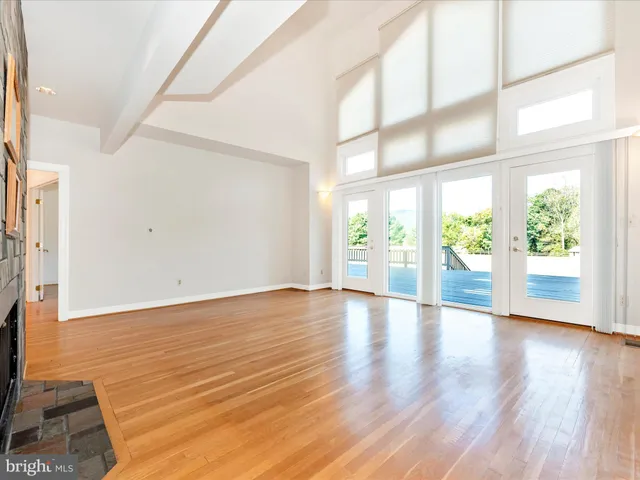 a room with white cabinets and white appliances