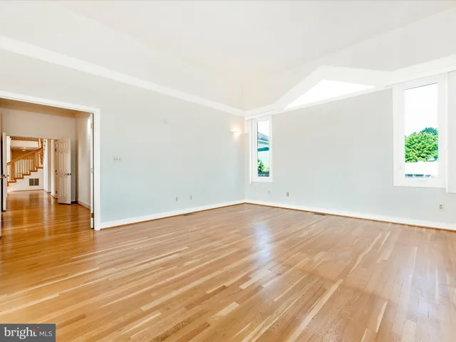 a view of a lake with houses in the back