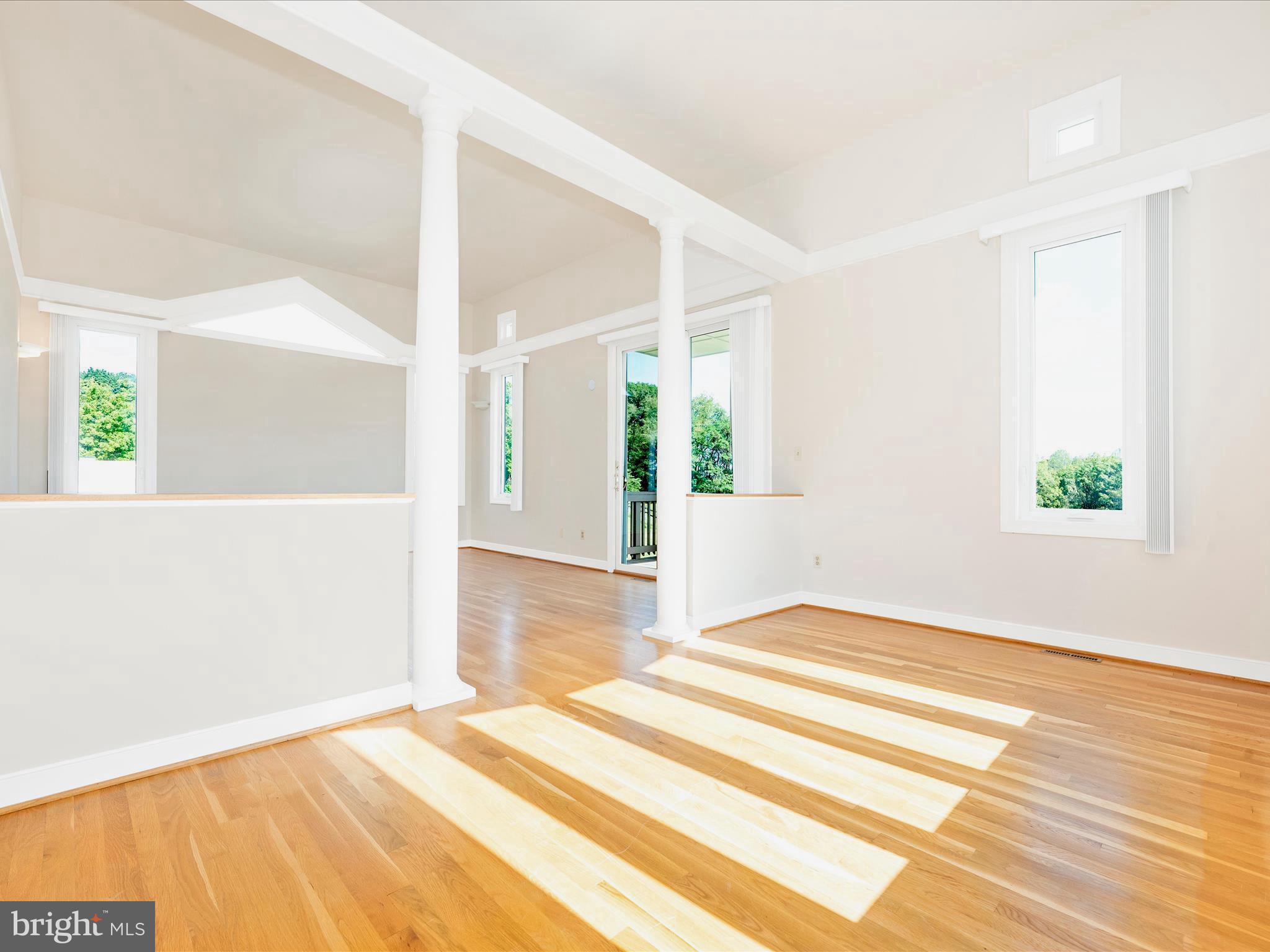 12 Barley Field Court Dickerson, MD 20842 - Photo 41 of 103 a view of an empty room with wooden floor and a window