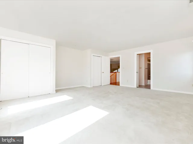 a view of a yard with a house in the background