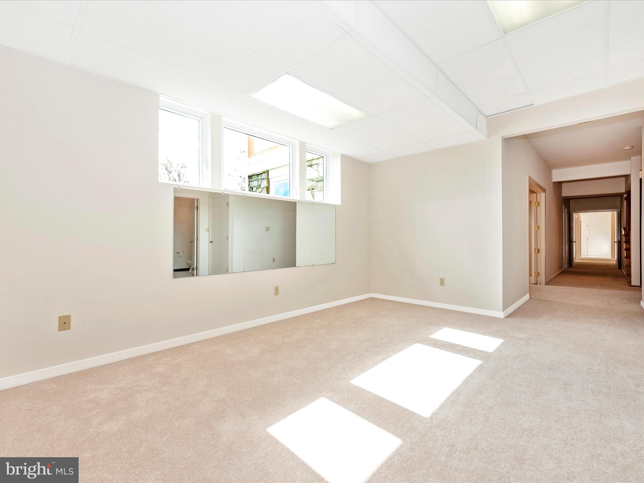 12 Barley Field Court Dickerson, MD 20842 - Photo 65 of 103 a view of an empty room with window and wooden floor