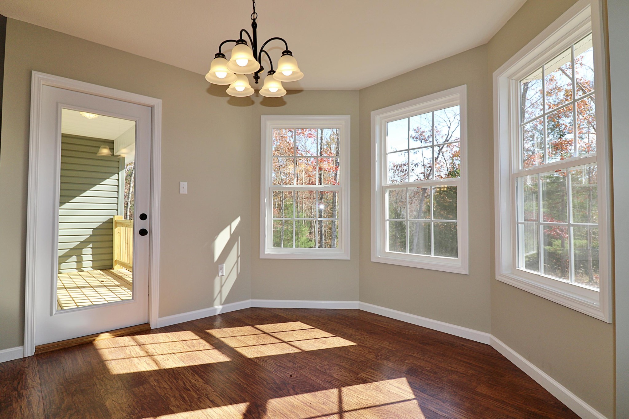 391 Toomey Falls Road Oneida, TN 37841 - Photo 16 of 42 a view of a bedroom with wooden floor and windows