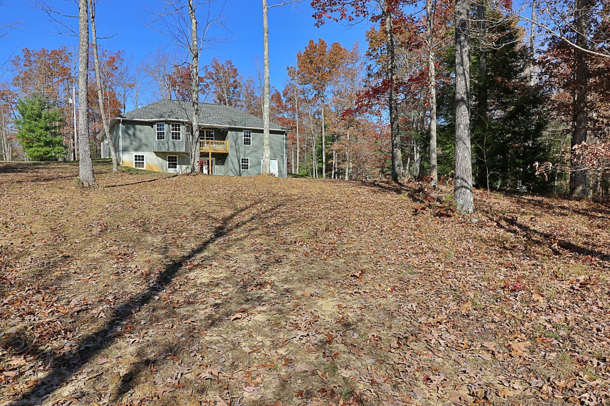 391 Toomey Falls Road Oneida, TN 37841 - Photo 20 of 42 a view of a houses with a yard