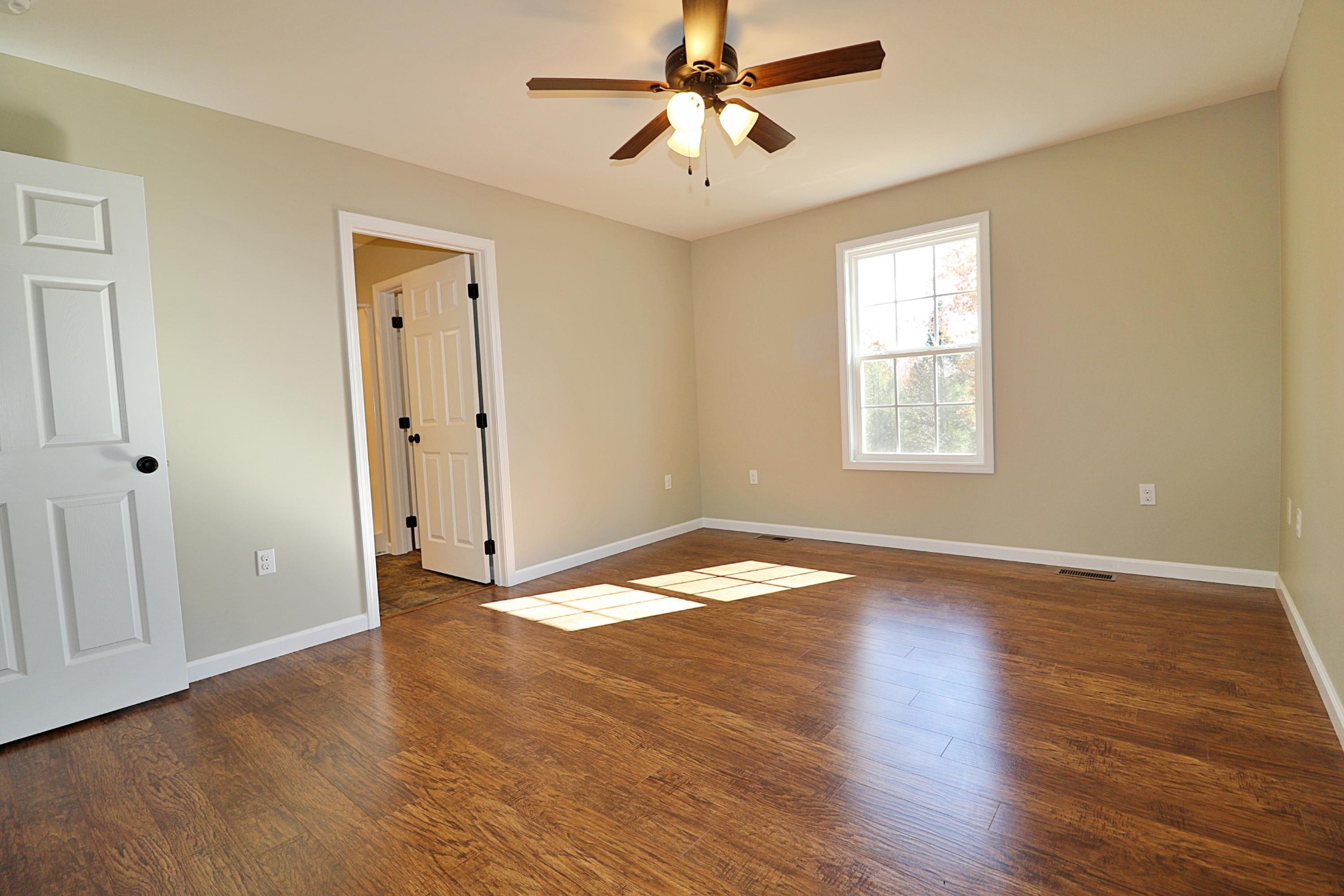 391 Toomey Falls Road Oneida, TN 37841 - Photo 25 of 42 a view of empty room with wooden floor and fan