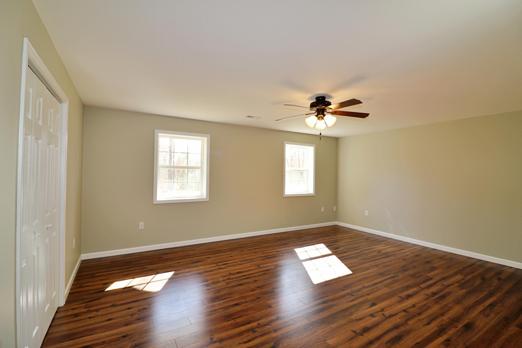 391 Toomey Falls Road Oneida, TN 37841 - Photo 31 of 42 a view of empty room with wooden floor and fan