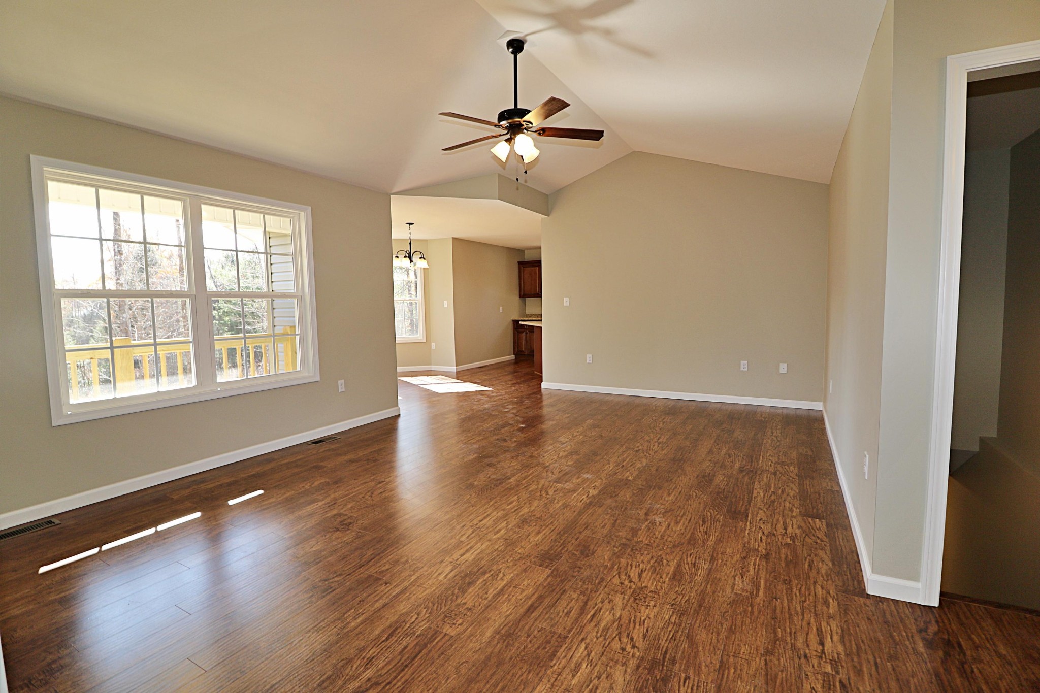 391 Toomey Falls Road Oneida, TN 37841 - Photo 5 of 42 a view of an empty room with wooden floor and a window