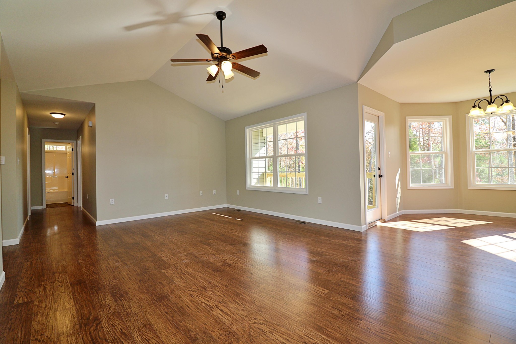 391 Toomey Falls Road Oneida, TN 37841 - Photo 6 of 42 a view of an empty room with window and wooden floor