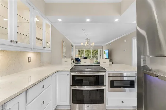 a kitchen with stainless steel appliances granite countertop a stove and a sink
